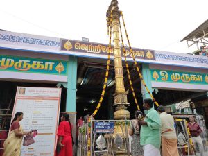 The tall Rajagopuram gateway of Vadapalani Murugan Temple rising under a clear sky in Chennai.
