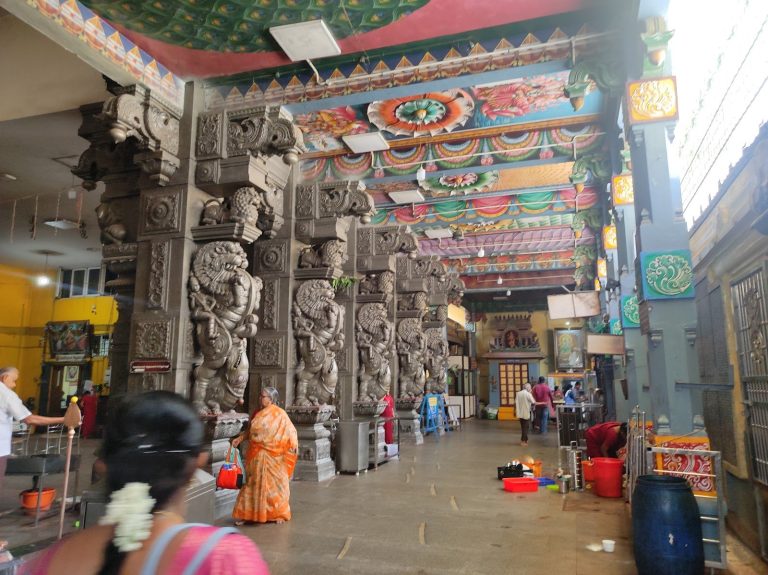 Carved Dravidian entrance tower and stone pillars of Kalikambal Temple in Chennai