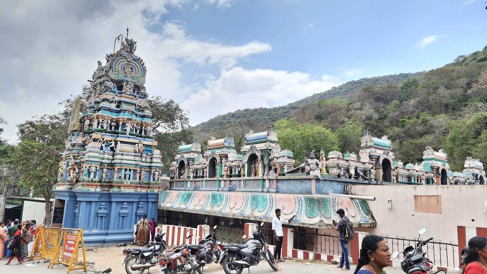Sculptured gopuram of Solaimalai Murugan Temple amid the trees of Alagar Hills