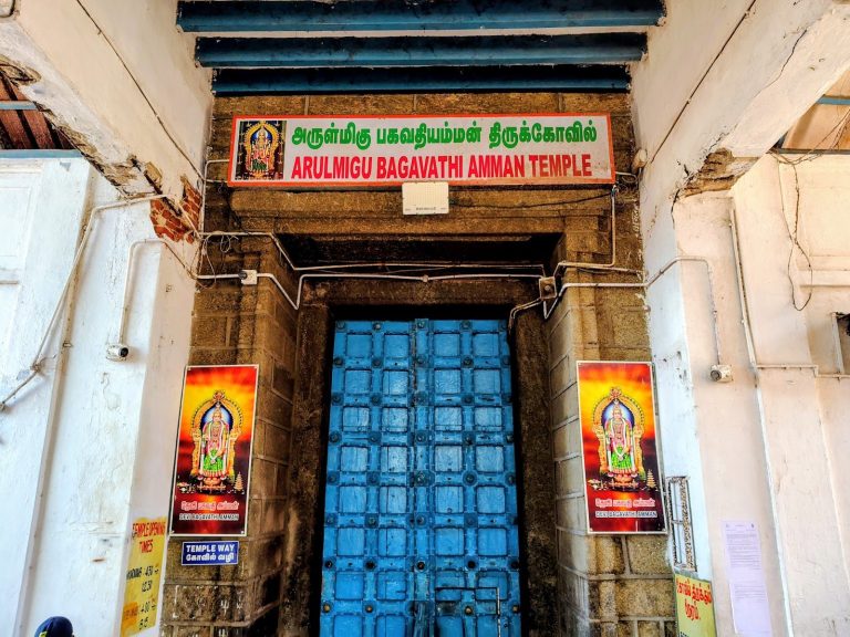 Granite gopuram and boundary walls of Kanyakumari Bhagavati Amman Temple near the sea.