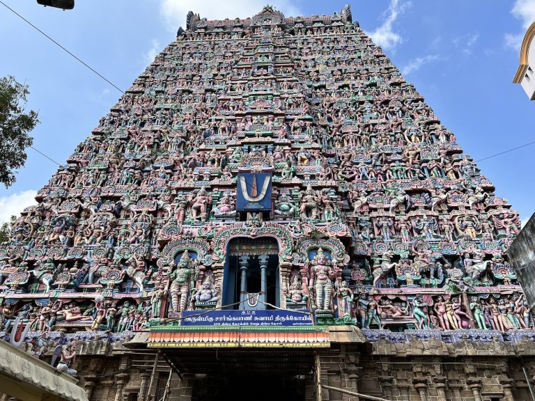 Tall stone gateway tower of Sri Sarangapani Swamy Temple rising over Kumbakonam town